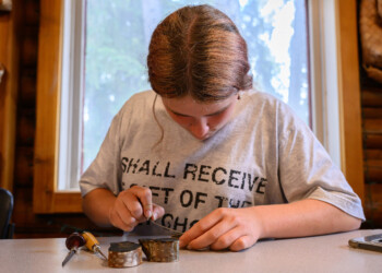 High school interns learn the basic techniques of wood engraving at The Folk School.