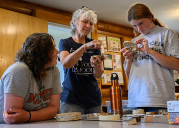 High school interns learn the basic techniques of wood engraving at The Folk School.