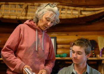 High school intern Clint Wright is given feedback on his final sketch.