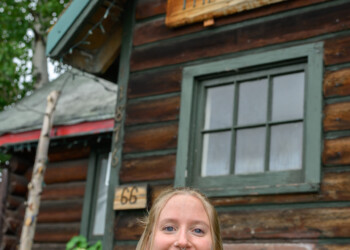 Education Director Shelby Morgan poses in front of The Folk School.