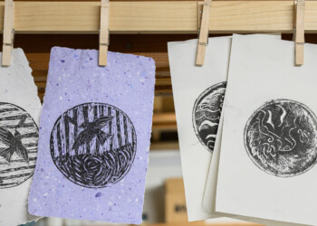 Final ink prints produced by high school interns wood engraved pieces.