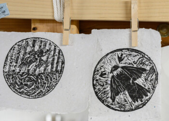 Final ink prints produced by high school interns wood engraved pieces.