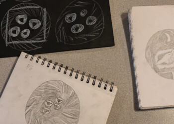 High school interns sketch their design ideas on paper before transferring them to wood cookies.